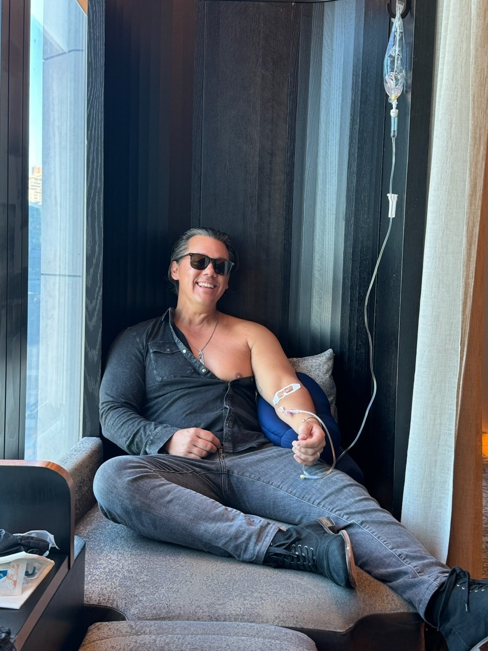 Angela Ferguson relaxing in a recovery chair after surgery